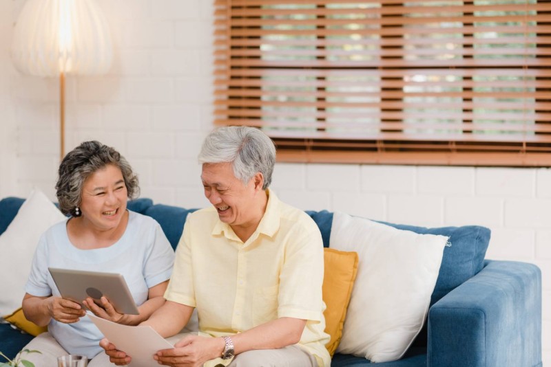asian-elderly-couple-using-tablet-watching-tv-living-room-home-couple-enjoy-love-moment-while-lying-sofa-when-relaxed-home.jpg
