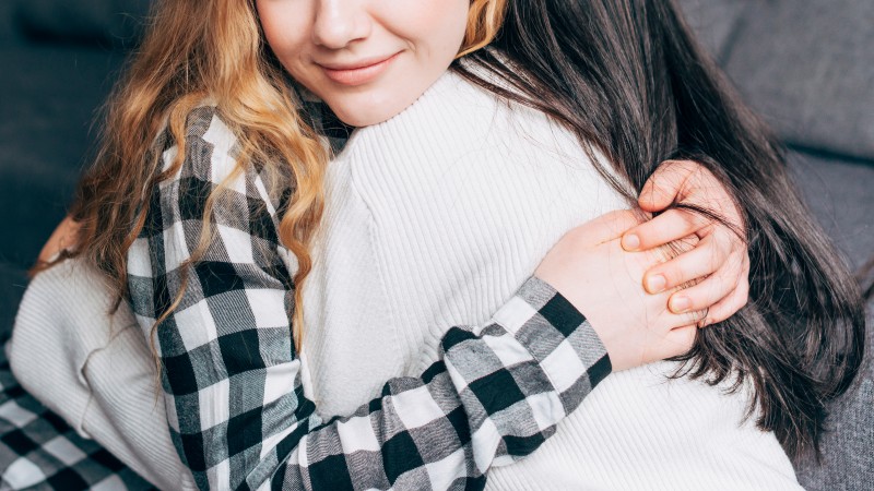 crop-females-hugging-home.jpg